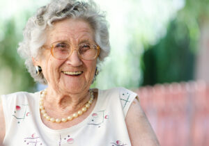 caregiving careers, older woman smiling