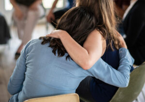 caregiver burnout, women with arms around each other